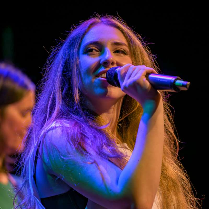 Former Lesson Studio student Wren Van performing on stage. 