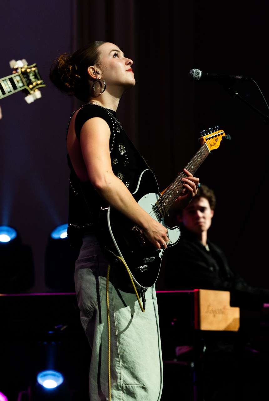 Wrenn Van performing on stage. 