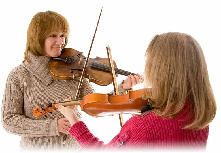 A music lessons teacher with a student A music lessons teacher with a student